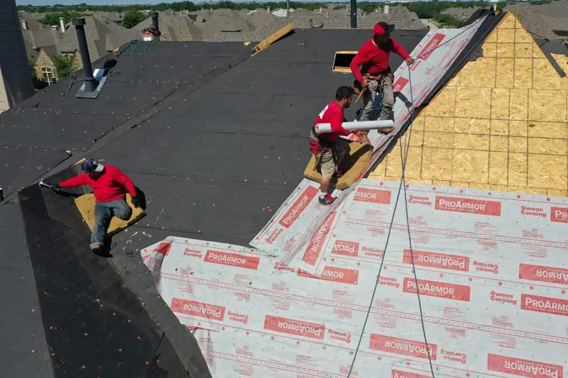 Kilker crew installing underlayment on a residential roof